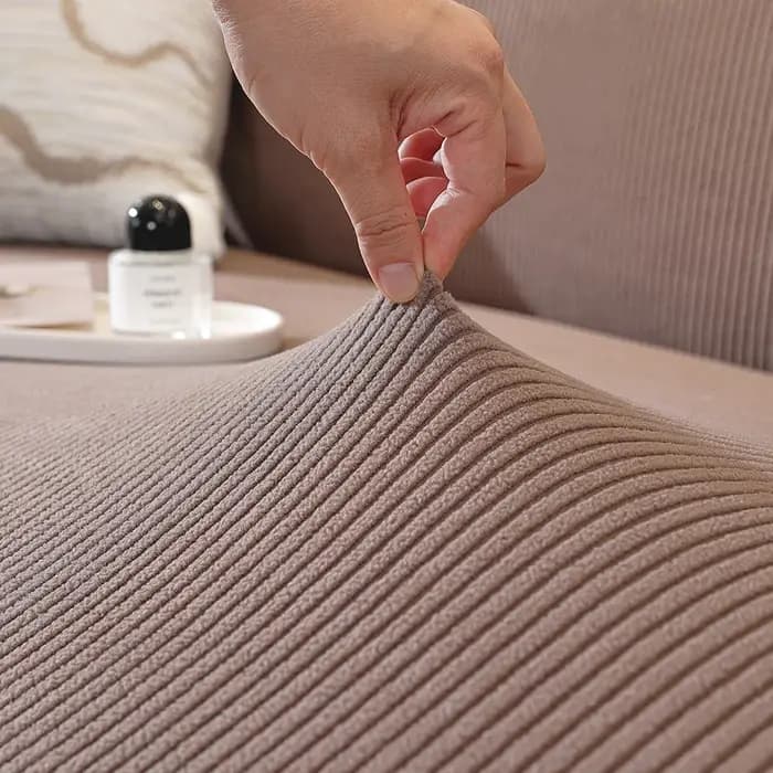 Housse de canapé de couleur unie avec bande élastique
