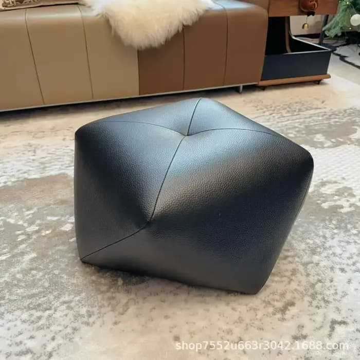 Tabouret en cuir à roulettes