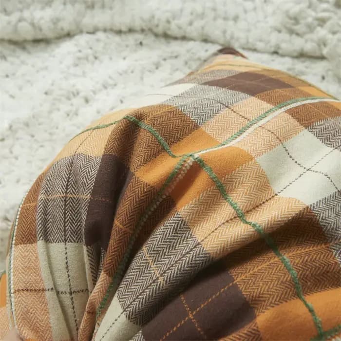 Juste de coussin floquée à carreaux
