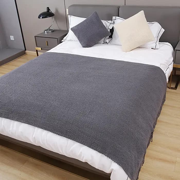 Couverture de canapé douce avec glands