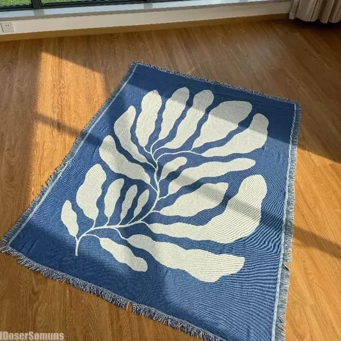 Couverture de canapé décontractée bleue avec glands
