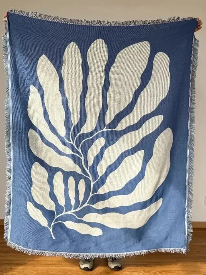 Couverture de canapé décontractée bleue avec glands