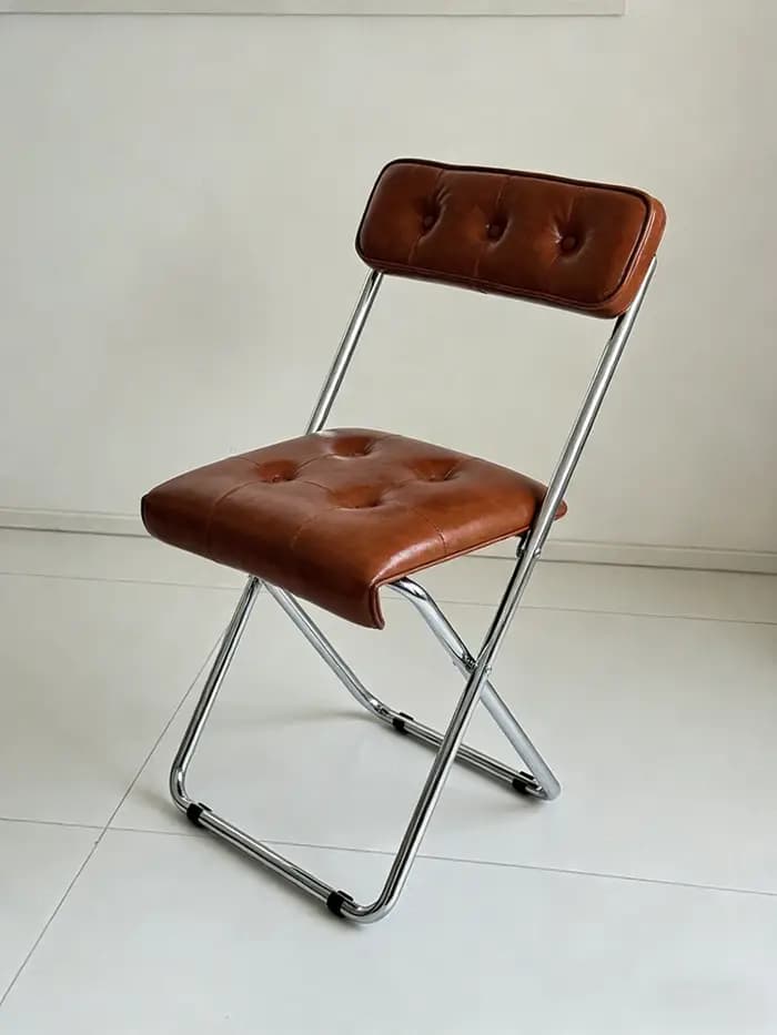Chaise pliante nordique en cuir huilé et métal