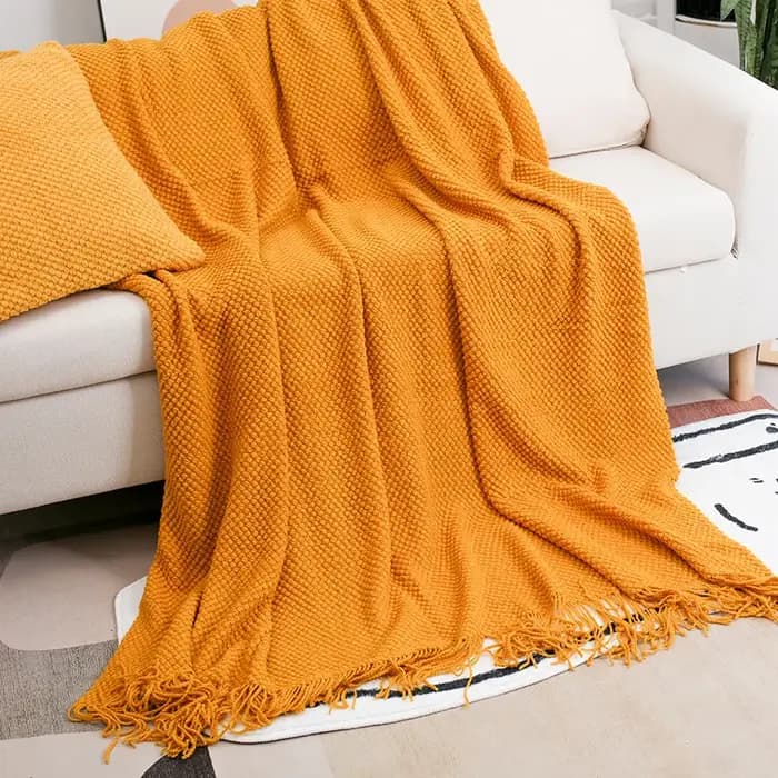 Couverture de canapé douce avec glands