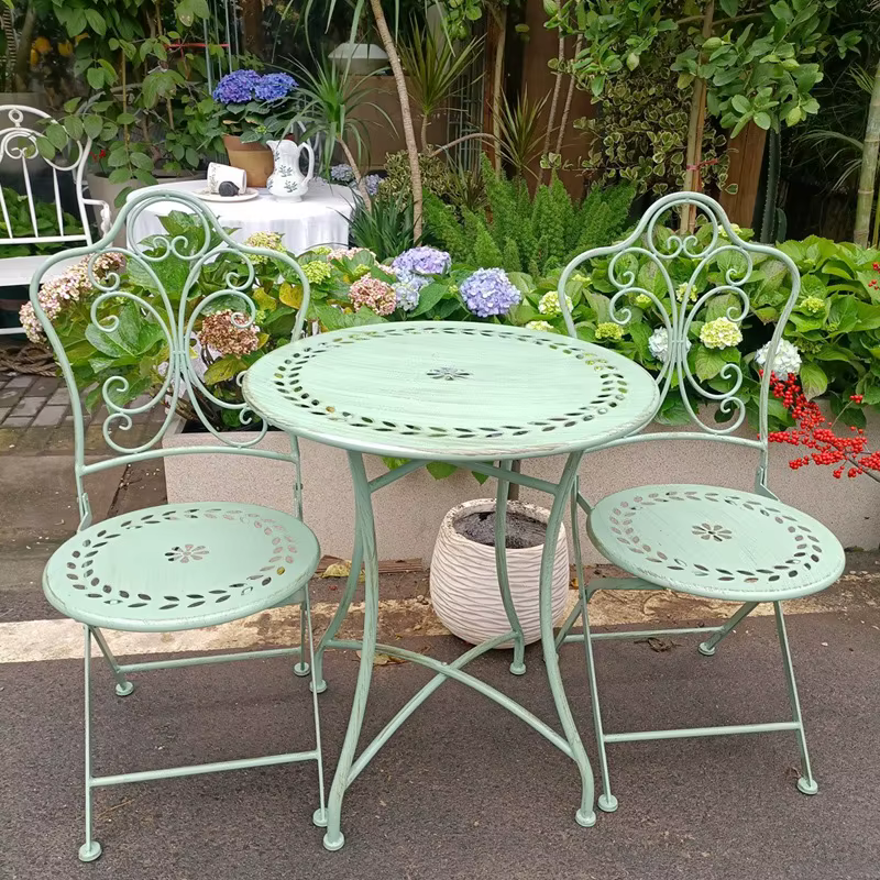 Silla Plegable américain rétro vieux motif creux chaise en fer forgé pliable cour extérieure Villa loisirs